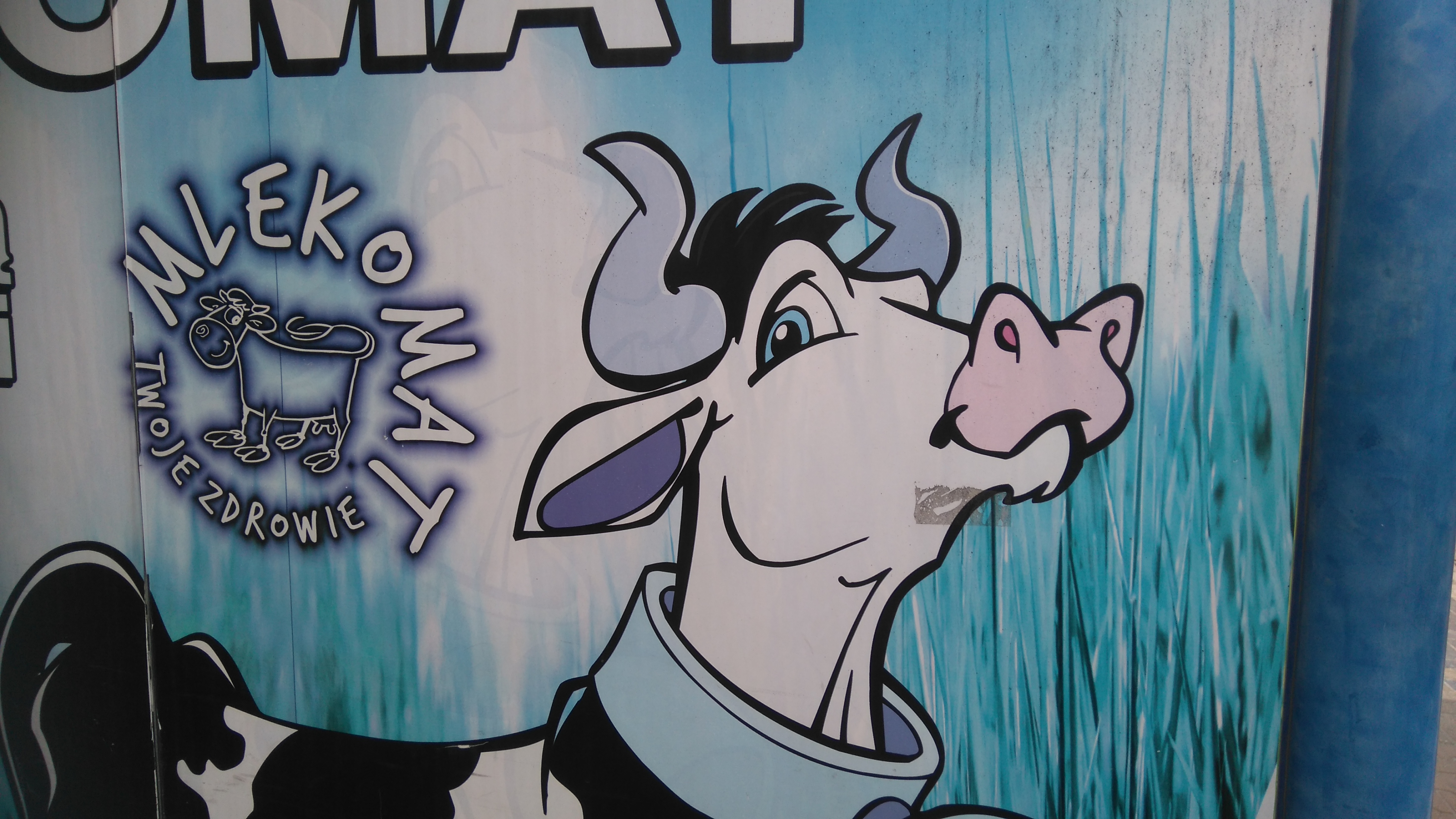 Wizerunek krowy na mlekomacie